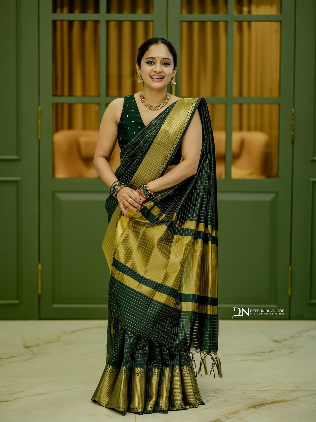 Lunar Green Banarasi Semi Katan saree with delicate gold zari butis, stylish check pallu, and matching blouse material