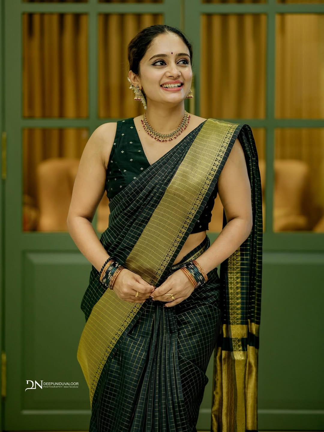 Banarasi Semi Katan Saree in Lunar Green with gold zari woven buti motifs, elegant check pallu, and matching blouse material