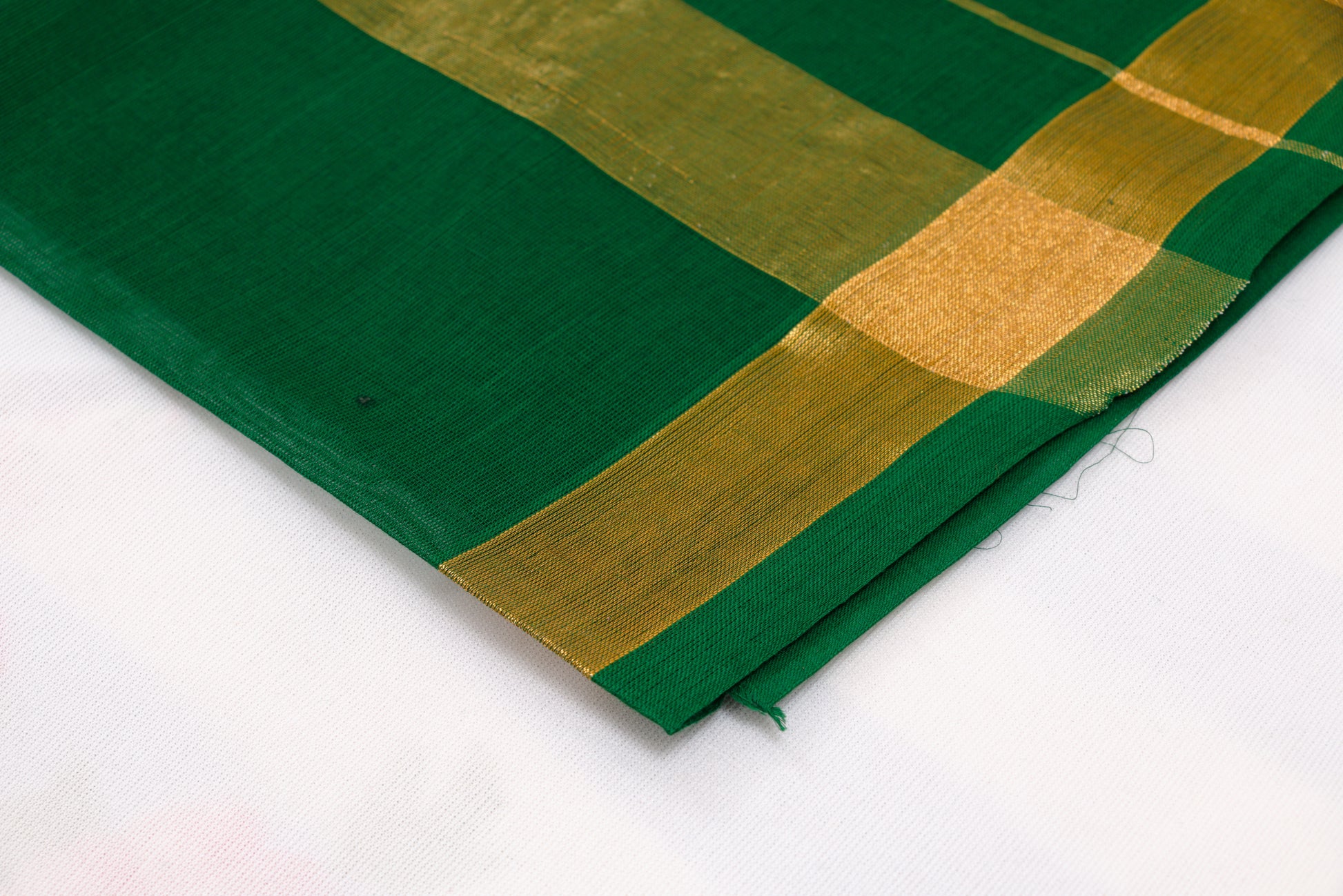 Classic green Venkatagiri cotton saree with zari stripes and ikat border