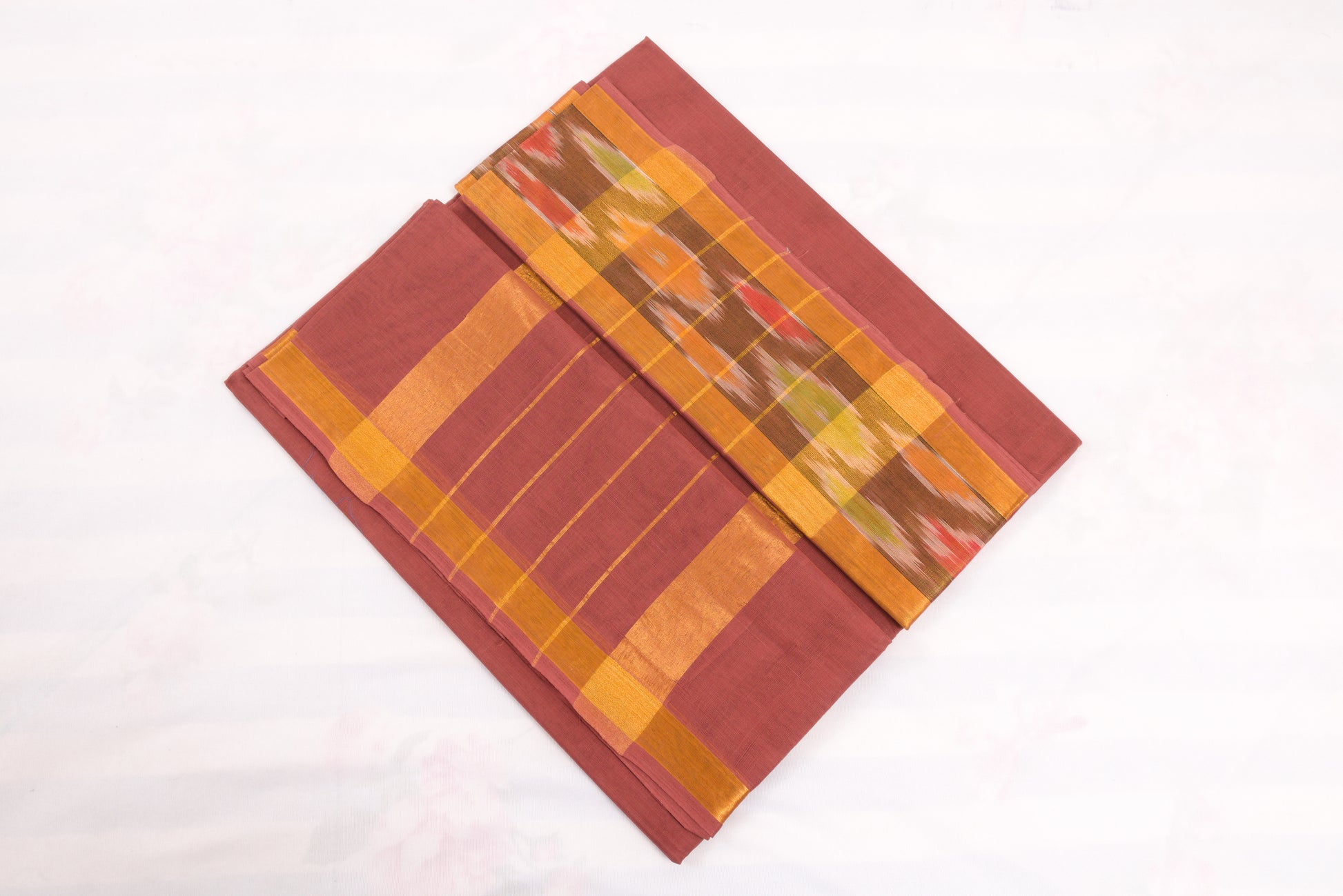 Handwoven Venkatagiri cotton saree in Maroon with ikat design border