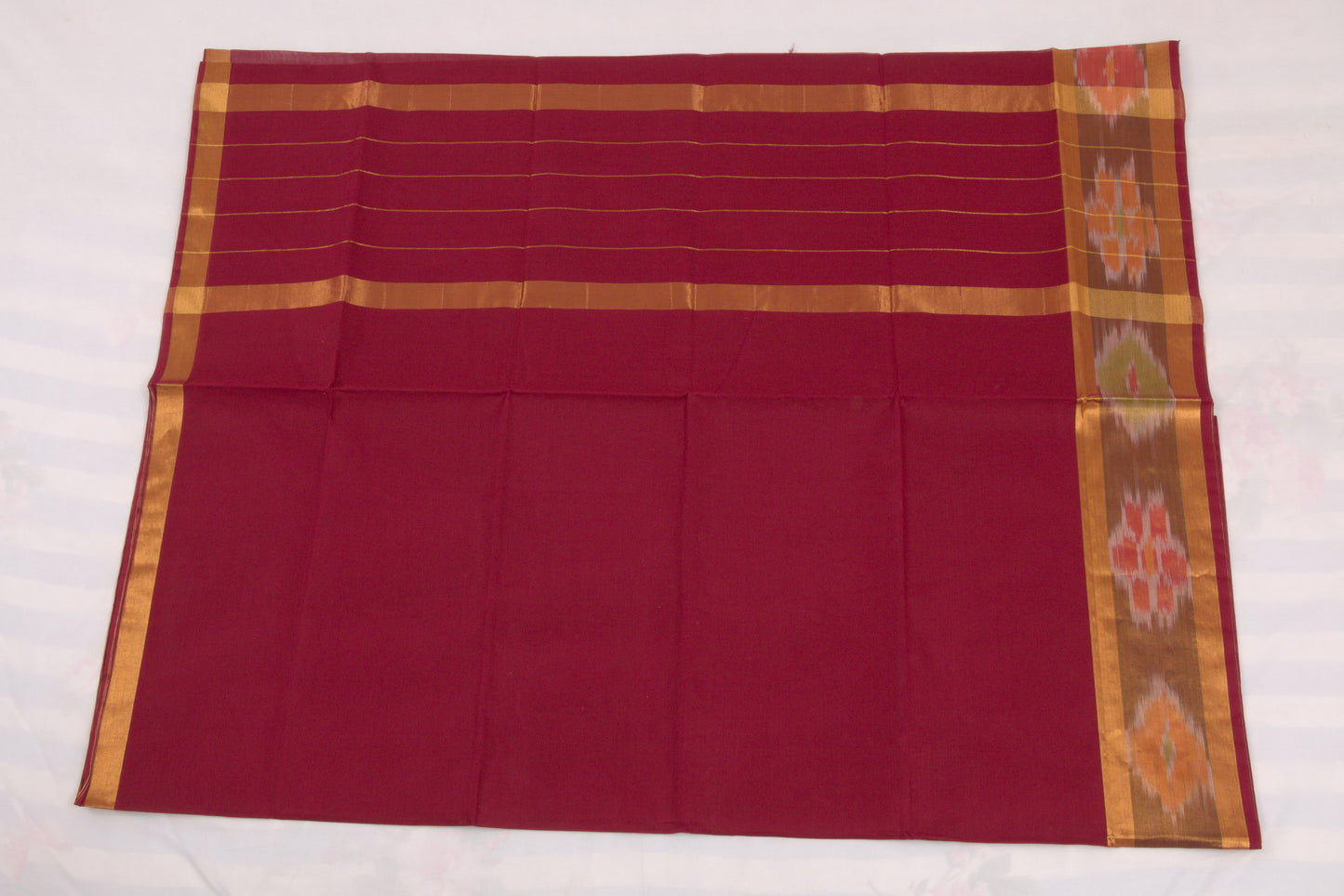 Handloom Venkatagiri saree in vivid burgundy with ikat border  
