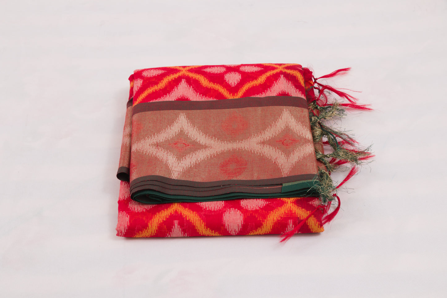 Bright red and green Pochampally Ikat saree with traditional geometric weaving patterns 