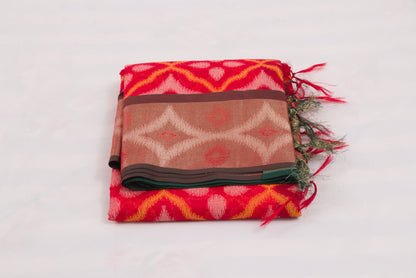 Bright red and green Pochampally Ikat saree with traditional geometric weaving patterns 