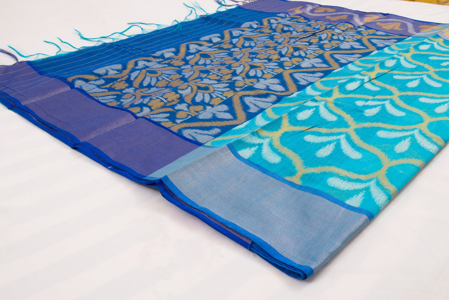 Traditional Telangana saree with detailed Ikat weaving and rich contrast border 