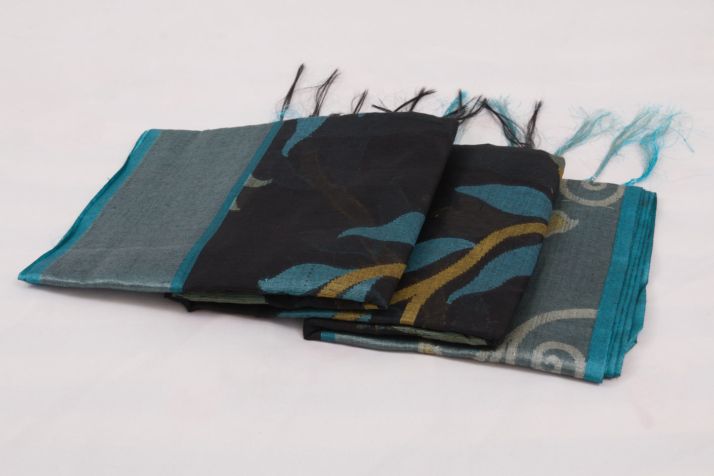 Elegant Pochampally Ikat silk saree with intricate woven designs and tassel detailing 