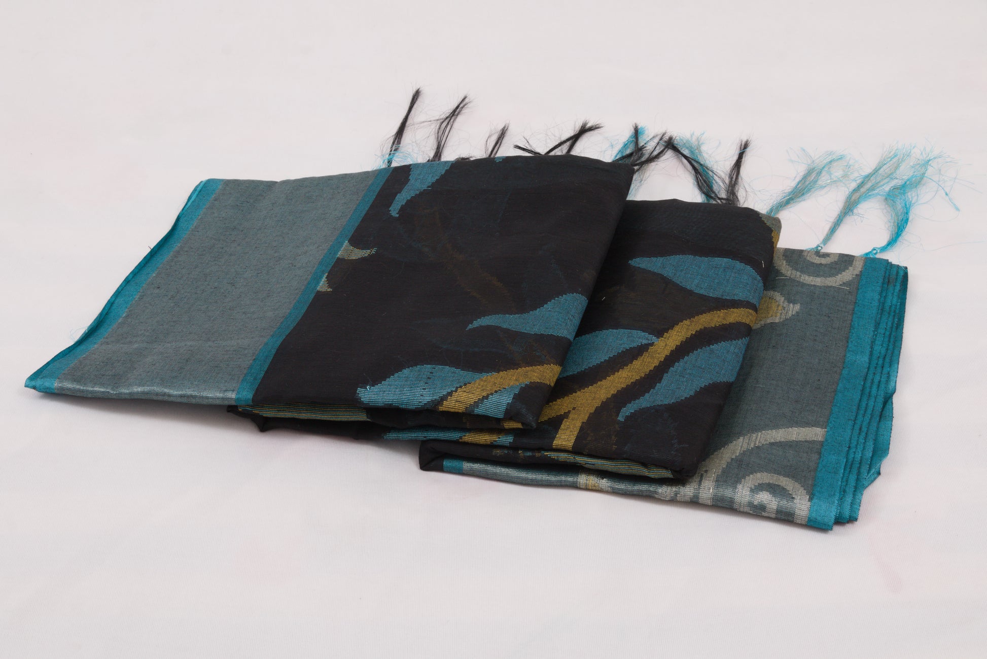 Elegant Pochampally Ikat silk saree with intricate woven designs and tassel detailing 
