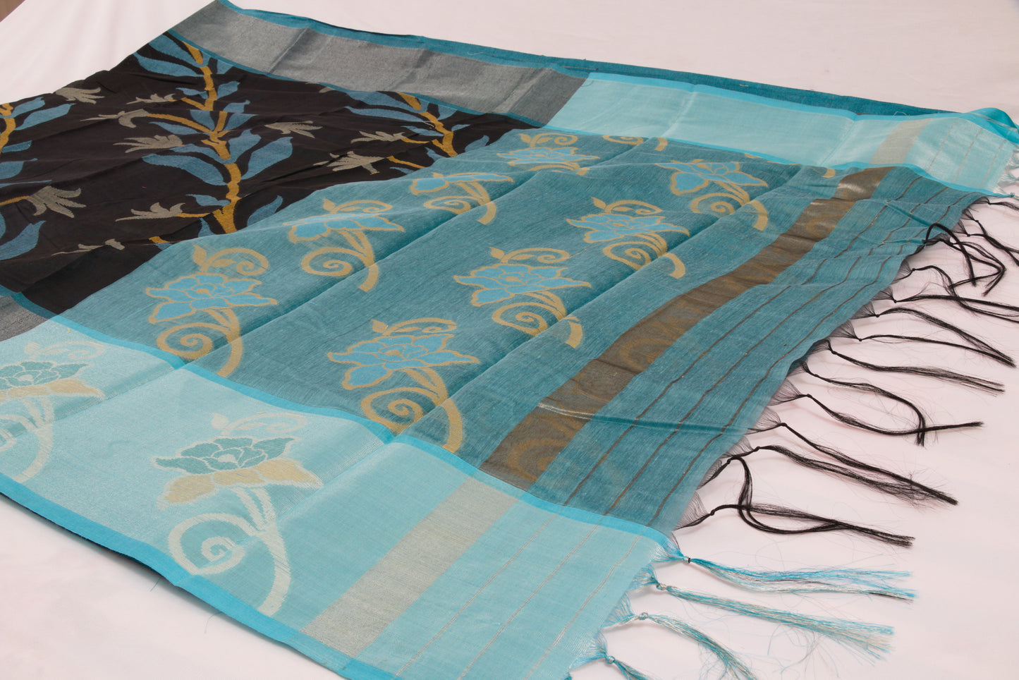 Colorful ethnic saree with handcrafted Ikat patterns and decorative woven border 