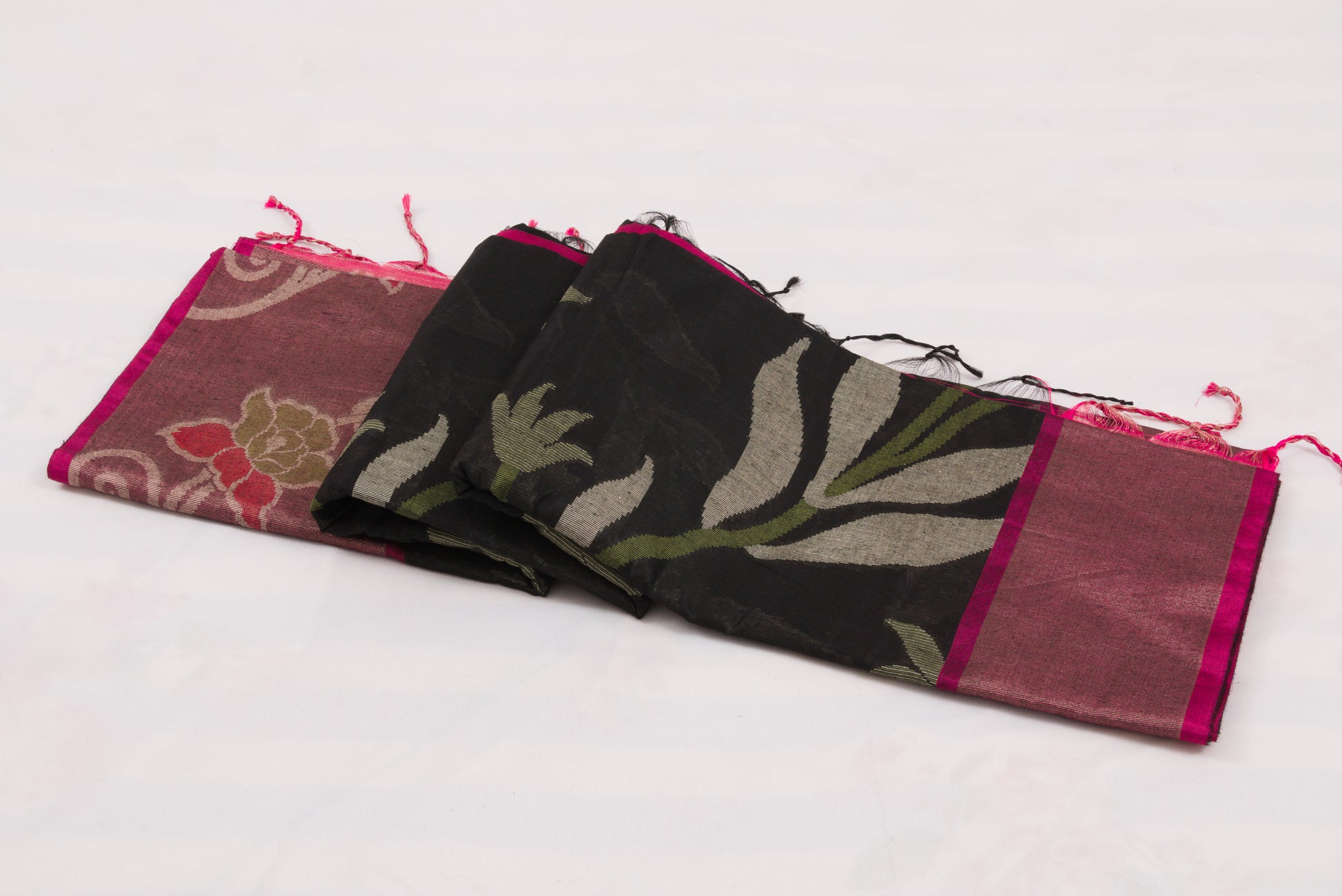 Traditional Indian handloom saree with black geometric body and pink floral border 