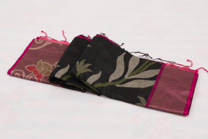 Traditional Indian handloom saree with black geometric body and pink floral border 