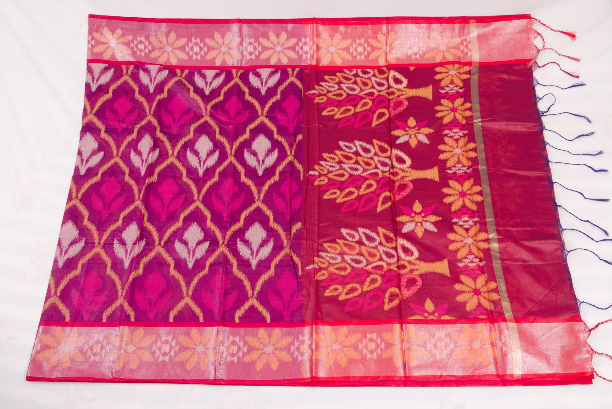 Elegant Pochampally Ikat silk saree with intricate woven designs and tassel detailing 