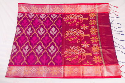 Elegant Pochampally Ikat silk saree with intricate woven designs and tassel detailing 