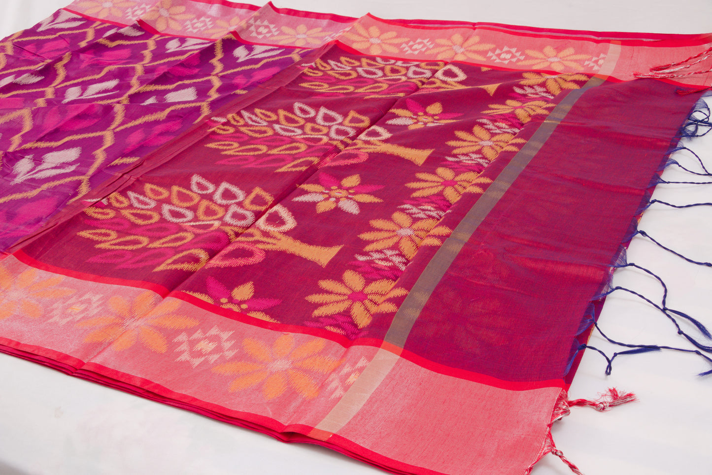 Colorful ethnic saree with handcrafted Ikat patterns and decorative woven border 