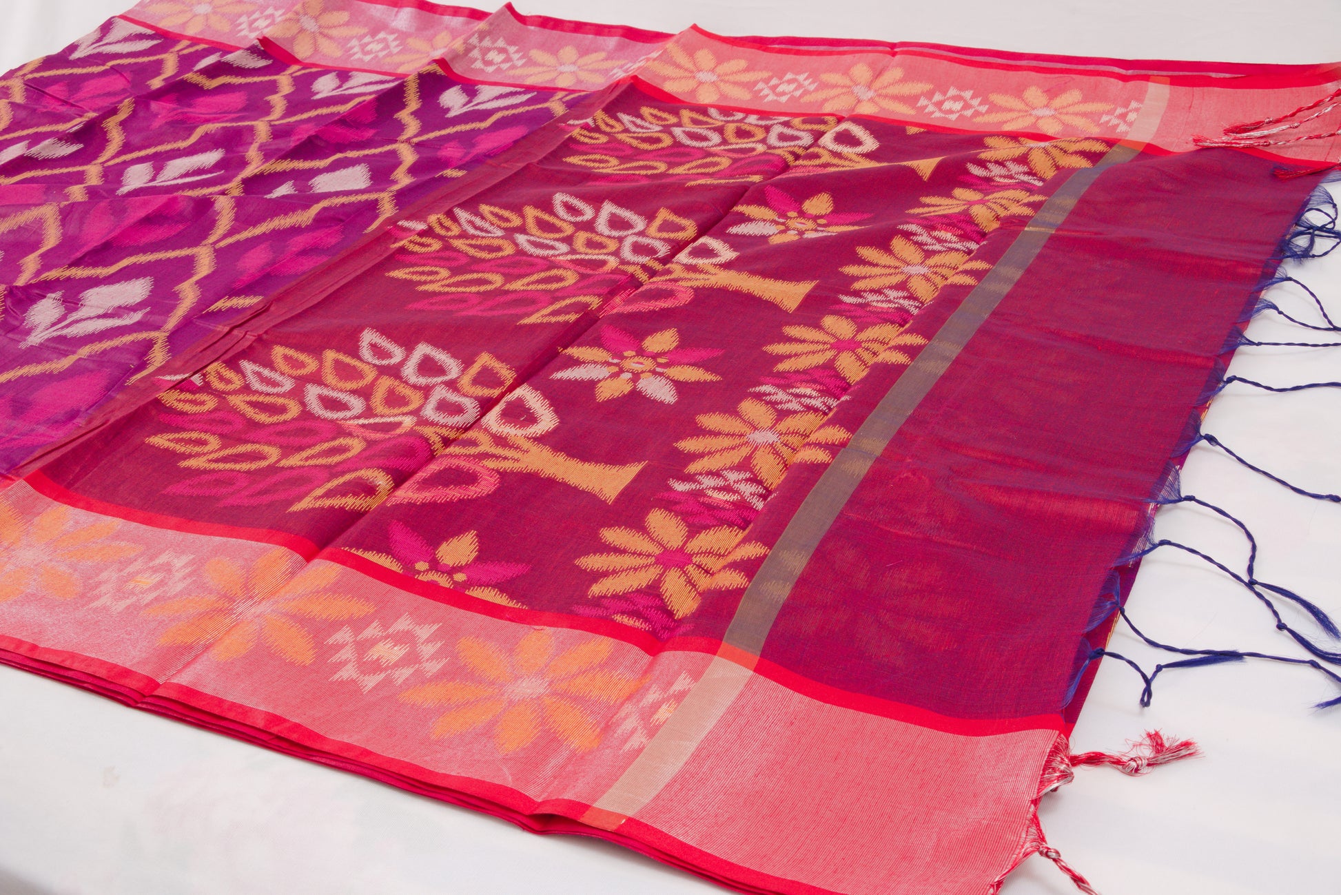 Colorful ethnic saree with handcrafted Ikat patterns and decorative woven border 