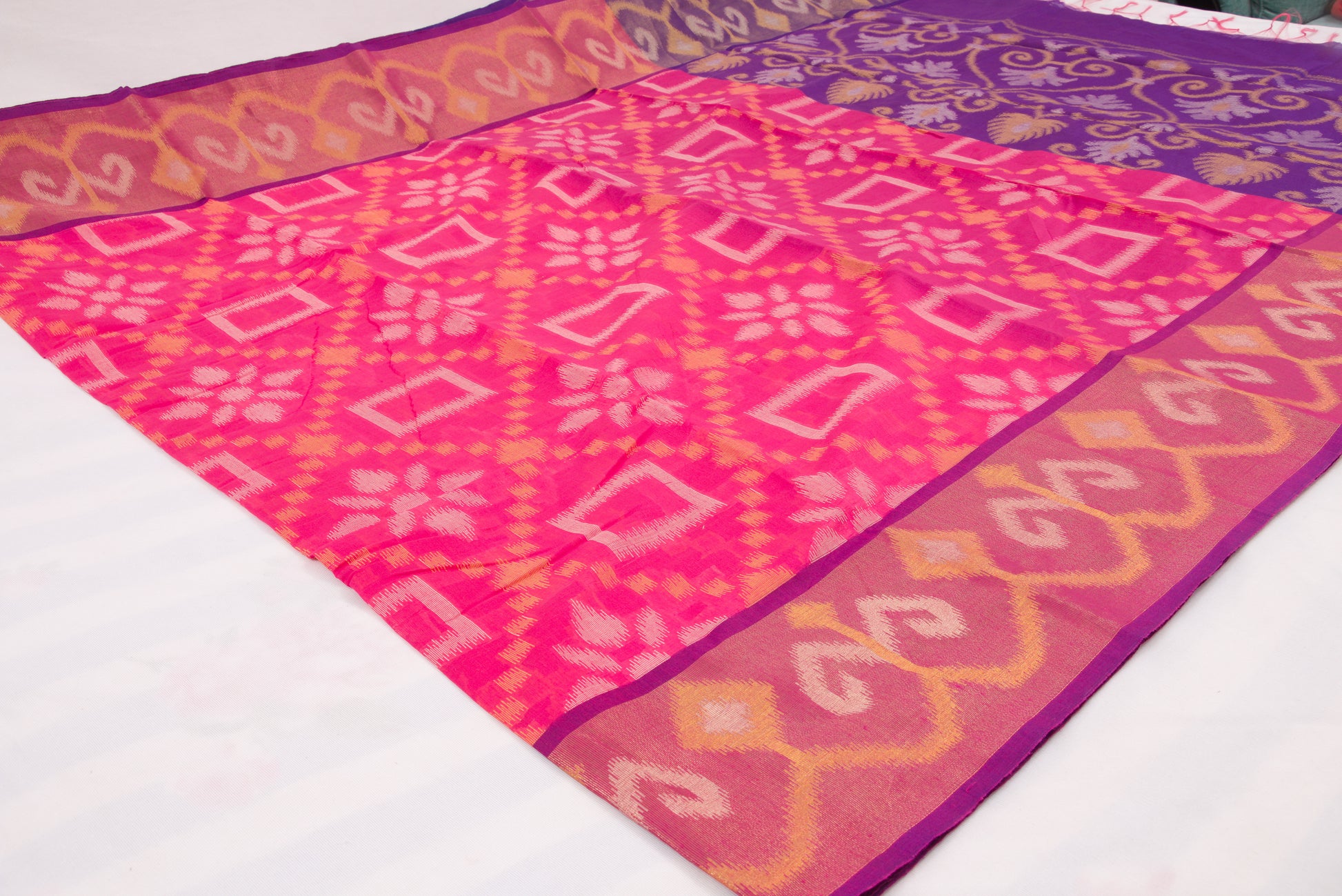 Traditional Telangana handloom saree with detailed Ikat weaving and rich contrast border 