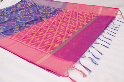 Elegant Pochampally Ikat silk saree with intricate woven designs and tassel detailing 