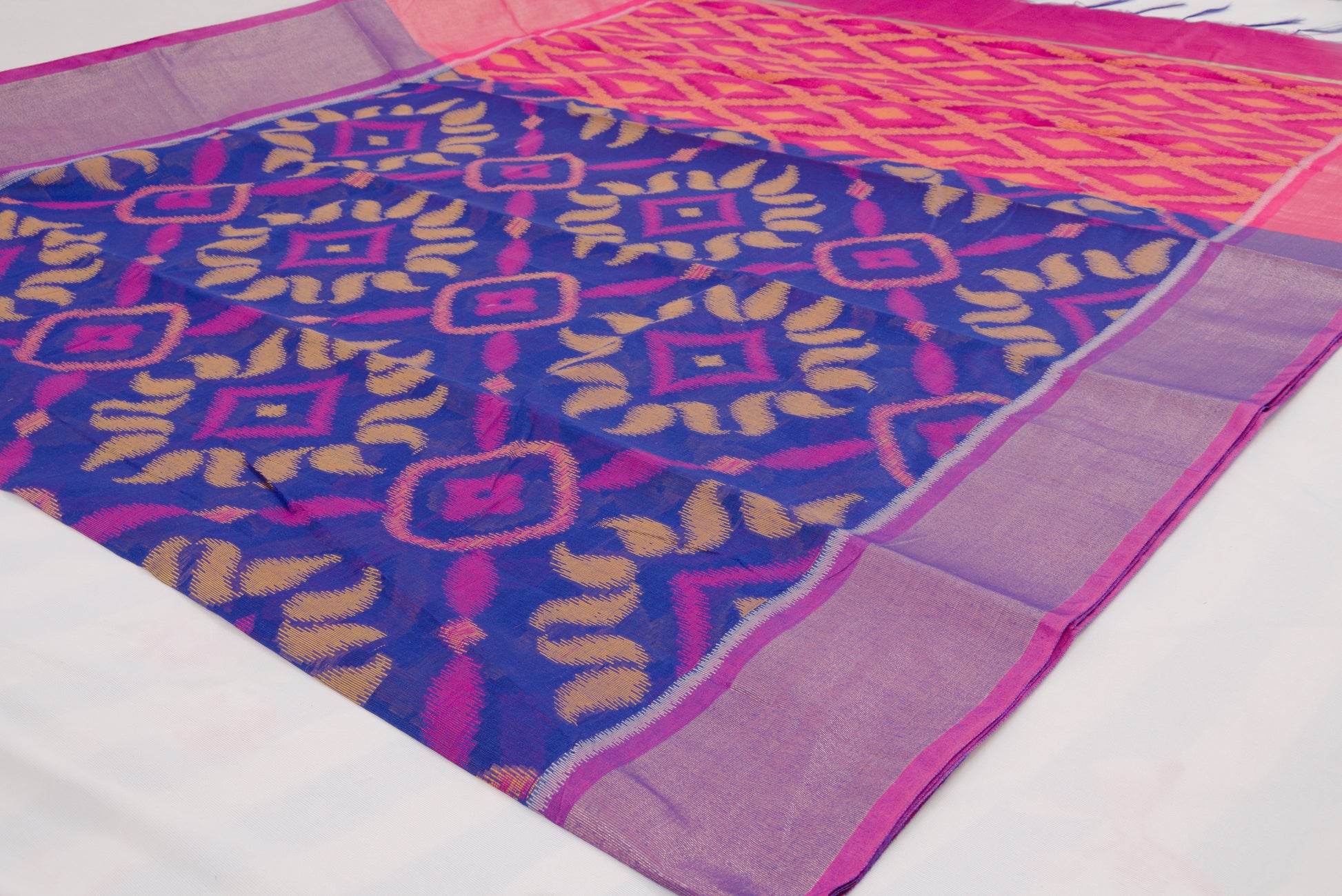 Colorful ethnic saree with handcrafted Ikat patterns and decorative woven border
