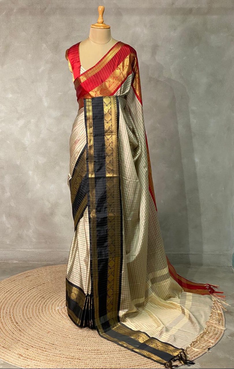 Elegant grey Banarasi silk saree with intricate zari buttas and rich pallu 