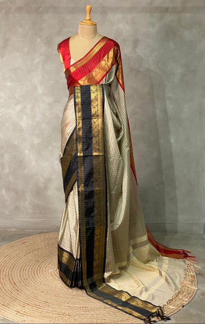 Elegant grey Banarasi silk saree with intricate zari buttas and rich pallu 
