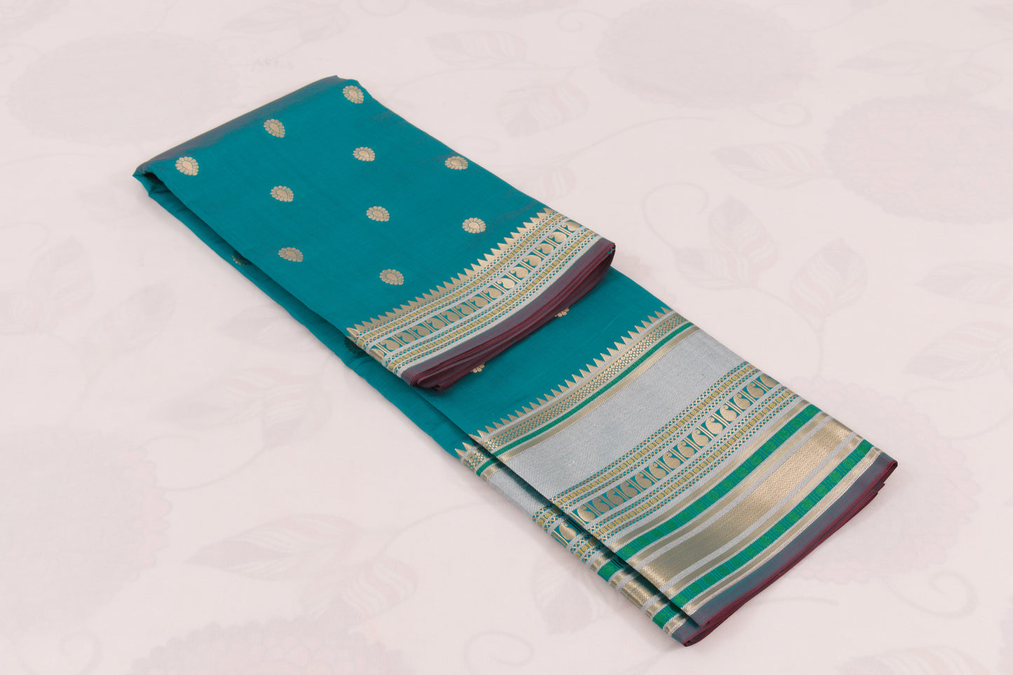 Elegant teal Banarasi Semi Katan saree with intricate gold zari buti design, traditional woven border, and blouse piece