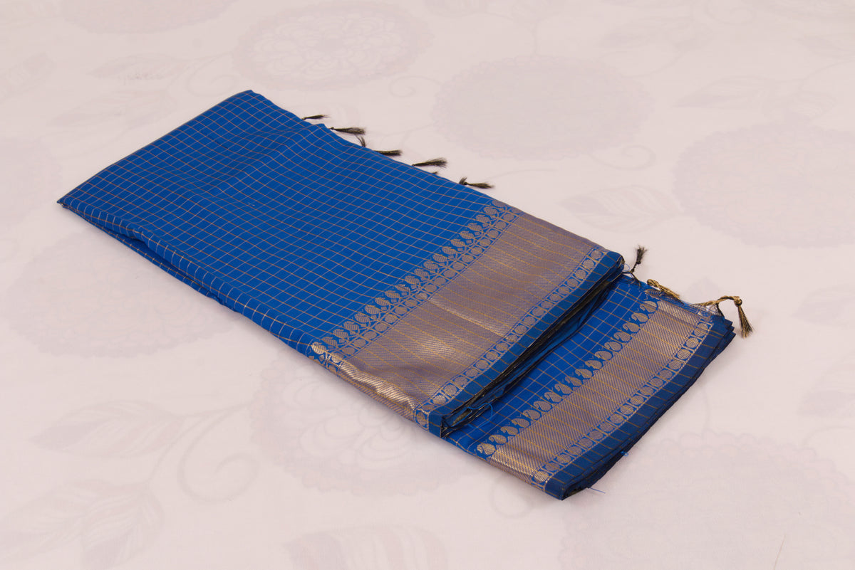 Elegant Bluish purple Banarasi Semi Katan saree with intricate gold zari buti design, traditional woven border, and blouse piece