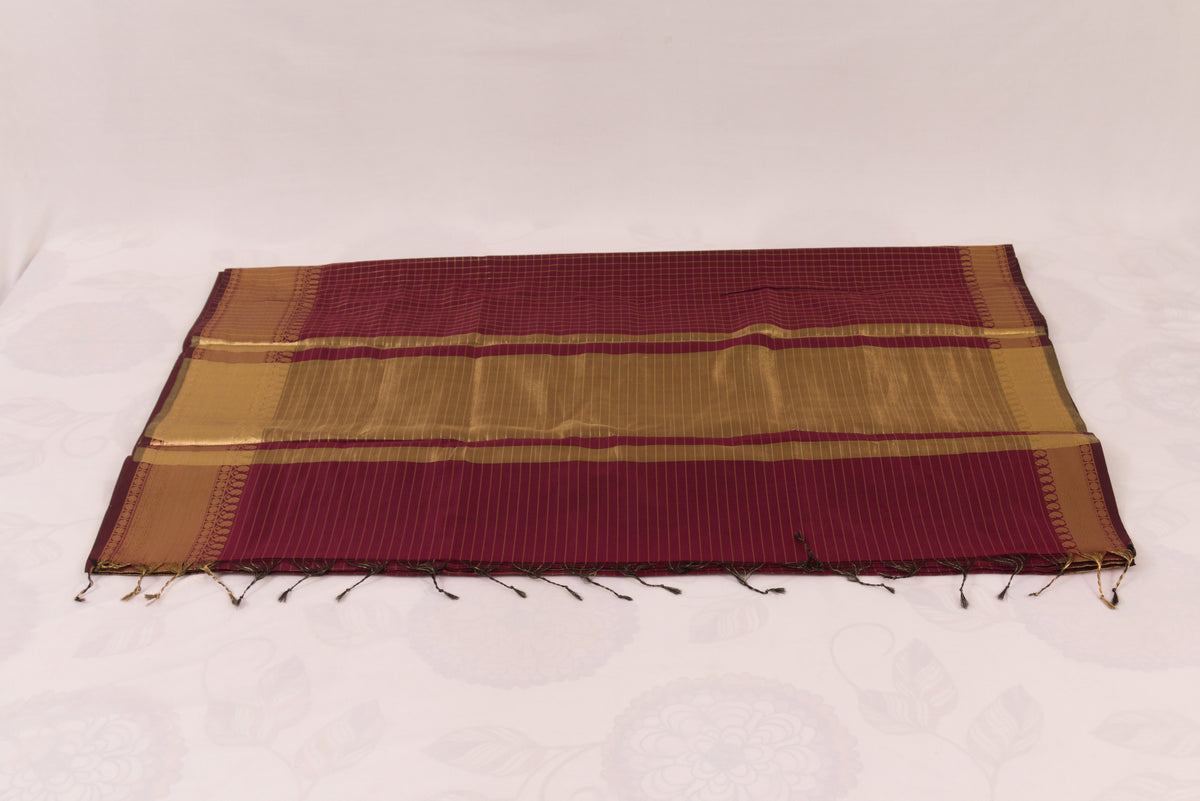 Elegant Wine Berry Banarasi Semi Katan saree with intricate gold zari buti design, traditional woven border, and blouse piece