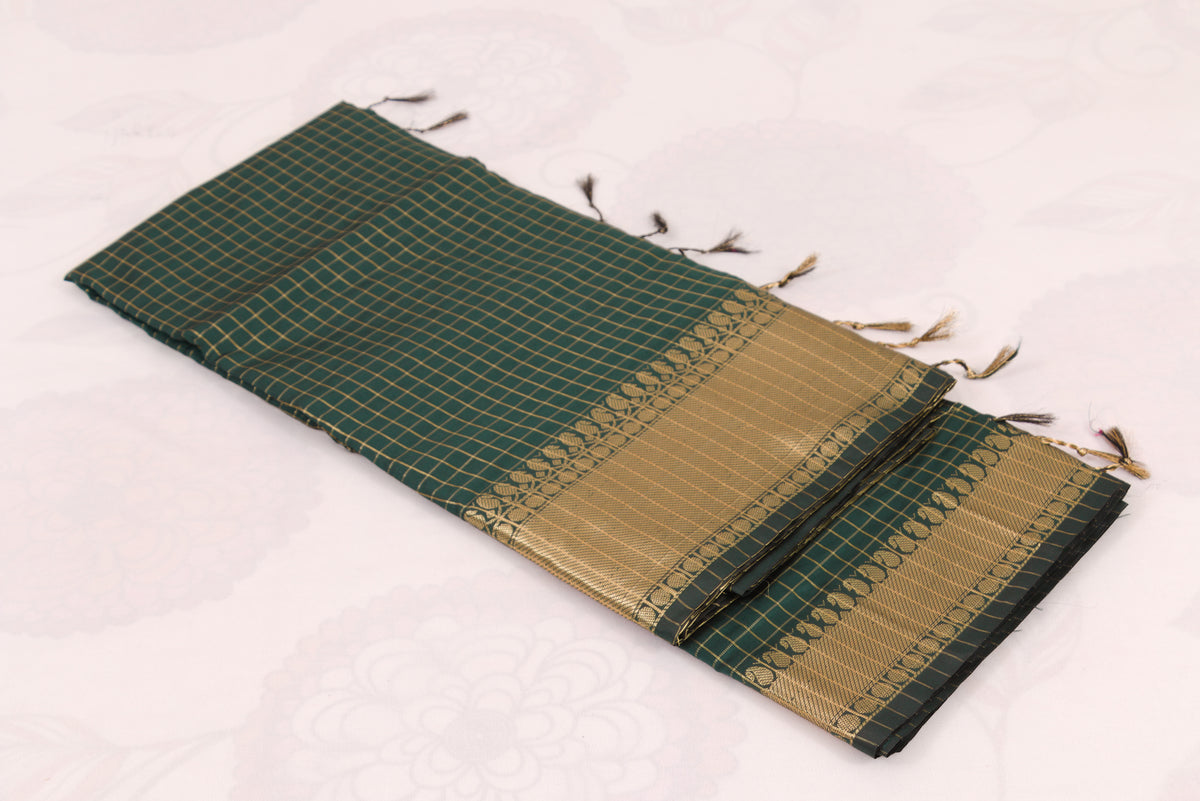 Elegant Lunar Green Banarasi Semi Katan saree with intricate gold zari buti design, traditional woven border, and blouse piece
