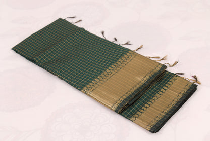 Elegant Lunar Green Banarasi Semi Katan saree with intricate gold zari buti design, traditional woven border, and blouse piece