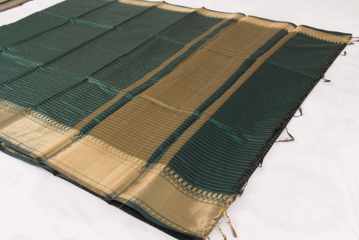 Lunar Green Banarasi Semi Katan saree with delicate gold zari butis, stylish check pallu, and matching blouse material